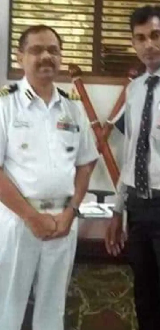 Trained laborers loading household furniture into truck in Madurai