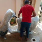 Professional bike packing service by Mahalaxmi Packers and Movers in Madurai using protective wrapping.