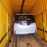 Toyota car loaded inside enclosed car carrier by Mahalaxmi Packers and Movers Madurai