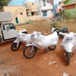 Four motorcycles securely packed for transportation in Paramakudi