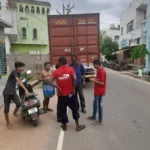 Moving team loading household goods into a transport truck during a house shifting service in Madurai.