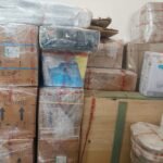 Mahalaxmi Packers and Movers branded cartons wrapped in stretch film with packed household goods ready for house shifting in Madurai