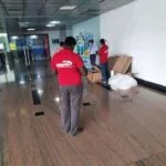 Office relocation team moving office furniture and equipment in Madurai.