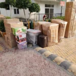 Packed household furniture and cartons ready for house shifting by Mahalaxmi Packers and Movers in Madurai.