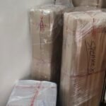 Packed household items wrapped and labelled for shifting in Paramakudi
