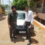Mahalaxmi Packers and Movers Madurai team with moving vehicle before a house shifting service.