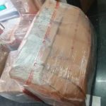 Professional stretch wrapping used to protect household furniture during house shifting in Madurai